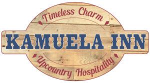 Logo with "Timeless Charm" at the top and "Upcountry Hospitality" at the bottom, in a circular wooden design. "Kamuela Inn" is prominently displayed in the center with bold blue letters.