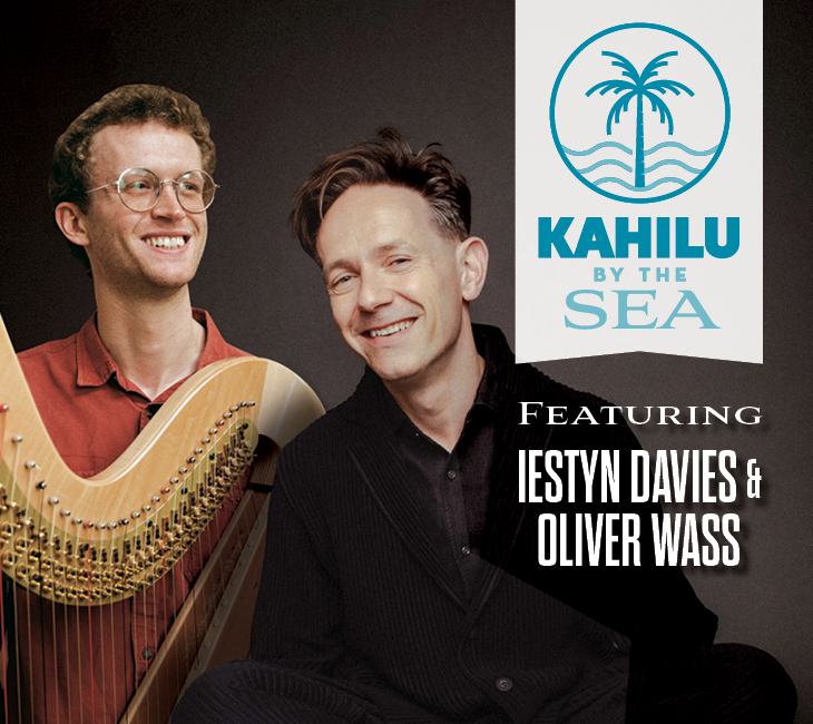 Two men, one holding a harp, smile in front of a “Kahilu by the Sea” logo, with text reading “Featuring Iestyn Davies & Oliver Wass.”.